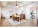 Dining room with a wooden table set, tray ceilings, bright windows and a decorative fireplace at 5612 Vintage View Blvd, Lakeland, FL 33812