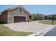 Charming single-Gathering home with a stone facade and a spacious driveway, nestled in a lovely neighborhood at 5612 Vintage View Blvd, Lakeland, FL 33812
