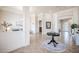 Spacious foyer featuring tile floors, white columns, and views into multiple living areas at 5612 Vintage View Blvd, Lakeland, FL 33812