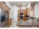 Well-equipped kitchen with stainless steel appliances, wood cabinets, and a breakfast bar at 5612 Vintage View Blvd, Lakeland, FL 33812