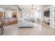 Bright living room featuring an open layout, modern sofa, ceiling fan, and seamlessly connected to the kitchen at 5612 Vintage View Blvd, Lakeland, FL 33812