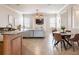 Open-concept living room with a kitchen island, neutral colors, and a ceiling fan at 5612 Vintage View Blvd, Lakeland, FL 33812