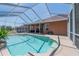 A screened-in pool with an outdoor seating area is perfect for relaxing and entertaining on a sunny day at 5612 Vintage View Blvd, Lakeland, FL 33812