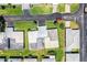 Top-down aerial shot of home exteriors and street layout in the community, with emphasis on landscaping at 610 Cottage Ln, Lakeland, FL 33803