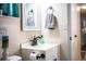 Well-lit bathroom with vanity, mirror, and towel, providing a clean and functional space at 610 Cottage Ln, Lakeland, FL 33803