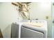 Functional laundry area features washer and dryer, ensuring convenience for household chores at 610 Cottage Ln, Lakeland, FL 33803