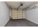 Spacious garage with carpeted floor, storage racks, and automatic door opener at 6315 Conductor Ct, Lakeland, FL 33813