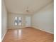 Cozy living room featuring wood floors, natural light, and a ceiling fan at 6315 Conductor Ct, Lakeland, FL 33813