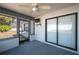 Relaxing enclosed patio with a ceiling fan and easy access to the outdoors at 6315 Conductor Ct, Lakeland, FL 33813