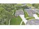 An eye-level shot showcases the home's manicured lawn and elegant architecture at 803 Allison Place, Bartow, FL 33830