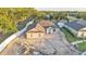 An aerial view showcasing a single-story home with a two-car garage in a landscaped setting at 803 Allison Place, Bartow, FL 33830