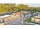 An aerial view showcasing a single-story home with a two-car garage in a landscaped setting at 803 Allison Place, Bartow, FL 33830