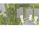 Aerial view of the home showcasing the roof, landscaping, and driveway at 803 Allison Place, Bartow, FL 33830