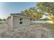 Exterior of the home showcasing the home's backyard and covered patio at 803 Allison Place, Bartow, FL 33830