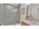 Modern bathroom featuring gray subway tile shower and vanity with stone countertop at 803 Allison Place, Bartow, FL 33830