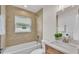 Bright bathroom with a shower over tub and a window for natural light at 803 Allison Place, Bartow, FL 33830