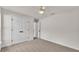 Clean, carpeted bedroom with a ceiling fan and a closet at 803 Allison Place, Bartow, FL 33830