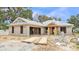 Exterior view of home under construction showcasing its basic structure and design elements at 803 Allison Place, Bartow, FL 33830