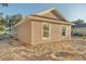 Exterior showcasing a home with bright exterior paint and newly installed windows at 803 Allison Place, Bartow, FL 33830