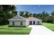 New construction home with a well-manicured lawn and a paved driveway at 803 Allison Place, Bartow, FL 33830