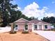 Charming single-story home featuring a manicured yard and inviting architectural details at 803 Allison Place, Bartow, FL 33830