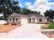 Charming single-story home featuring a neutral color scheme, attached two-car garage, and a well-manicured front yard at 803 Allison Place, Bartow, FL 33830
