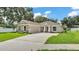Charming single-story home featuring manicured landscaping and a spacious driveway at 803 Allison Place, Bartow, FL 33830