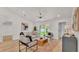 Comfortable living room with contemporary decor, wood-look floors, and plenty of natural light at 803 Allison Place, Bartow, FL 33830