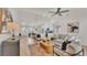Open-concept living area leading into a modern kitchen with a large island and bar seating at 803 Allison Place, Bartow, FL 33830