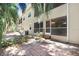 Outdoor patio and screened in porch for relaxing or entertaining surrounded by lush tropical trees at 8838 Coral Palms Ct # A, Kissimmee, FL 34747
