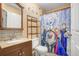 Cozy bathroom has a shower with a 'Frozen' themed shower curtain at 8838 Coral Palms Ct # A, Kissimmee, FL 34747