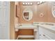 Bright bathroom with stylish mirrors, lots of light, and neutral countertops at 8838 Coral Palms Ct # A, Kissimmee, FL 34747