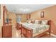 Comfortable bedroom offers two beds with stylish bedding and a wooden dresser at 8838 Coral Palms Ct # A, Kissimmee, FL 34747