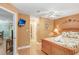 Comfortable bedroom boasts beach-themed décor and a mounted TV for relaxing evenings at 8838 Coral Palms Ct # A, Kissimmee, FL 34747