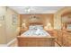 Comfortable bedroom featuring beach themed decor, natural wood, and cozy lighting at 8838 Coral Palms Ct # A, Kissimmee, FL 34747