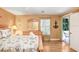 Relaxing bedroom with a dresser, balcony access, and beautiful beachy decor at 8838 Coral Palms Ct # A, Kissimmee, FL 34747