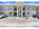 Two-story apartment building showing unit entrances and on-site parking at 8838 Coral Palms Ct # A, Kissimmee, FL 34747