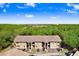 A bright two-story apartment building with ample parking and a lush green background at 8838 Coral Palms Ct # A, Kissimmee, FL 34747