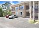 Building exterior of the complex with stairs to the upper levels and ample parking space for residents at 8838 Coral Palms Ct # A, Kissimmee, FL 34747