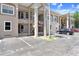 Building exterior of the complex with stairs to the upper levels and ample parking space for residents at 8838 Coral Palms Ct # A, Kissimmee, FL 34747