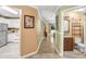 Interior view of kitchen, hallway, and bathroom with wood and ceramic tile floors at 8838 Coral Palms Ct # A, Kissimmee, FL 34747