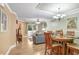 Open concept living and dining area with hardwood floors and modern lighting at 8838 Coral Palms Ct # A, Kissimmee, FL 34747