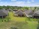 Aerial view of home with lush backyard and screened patio at 1049 Stoney Creek Dr, Lakeland, FL 33811