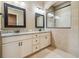 Bathroom with granite countertop, double sinks, and walk in shower at 1049 Stoney Creek Dr, Lakeland, FL 33811