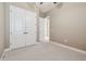 Comfortable bedroom with carpet, a double door closet, and neutral wall color at 1049 Stoney Creek Dr, Lakeland, FL 33811