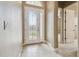 Inviting entryway with decorative glass door and neutral tile flooring at 1049 Stoney Creek Dr, Lakeland, FL 33811