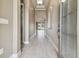 Bright hallway with tile flooring leading to living areas at 1049 Stoney Creek Dr, Lakeland, FL 33811