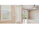 Living room with recessed lights and sliding glass doors that provide backyard access at 1049 Stoney Creek Dr, Lakeland, FL 33811