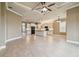 Spacious living room showcases tile floors and an open floor plan to the kitchen at 1049 Stoney Creek Dr, Lakeland, FL 33811