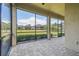 Screened in patio offering views of the well maintained backyard at 1049 Stoney Creek Dr, Lakeland, FL 33811